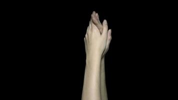 Hands applauding isolated on a black background. Clapping hands over a black background photo