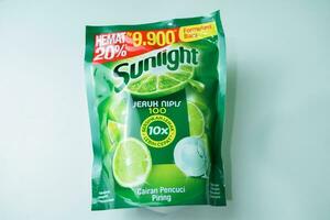 Sunlight anti bau jeruk nipis dan daun mint, a brand of liquid detergent for kitchenware washing with lime and mint leaf scent, isolated on white background. Bekasi, Indonesia, December 14, 2023 photo