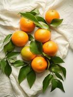 AI generated eight tangerines on white cloth, with green leaves, everyday ephemera, organic material photo