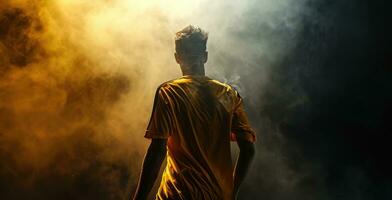 ai generado un fútbol jugador en un amarillo camiseta en un oscuro antecedentes foto