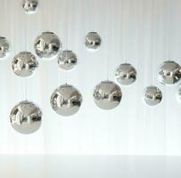 AI generated shiny disco balls and shadows on white surface photo