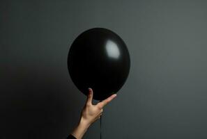 AI generated person pointing hands to a black balloon, photo