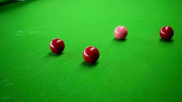 Footage of a snooker ball being hit and running into another ball. video