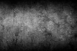 Dark grey or black concrete wall textured background photo