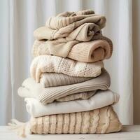 AI generated a stack of knit sweaters on an image background photo
