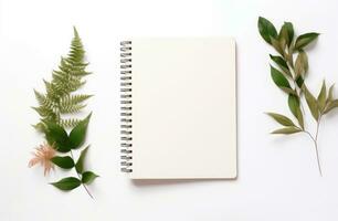 AI generated white background with empty notepad and green leaves around a white background photo