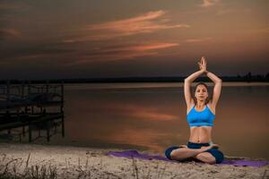 yoga at sunset on the beach. photo