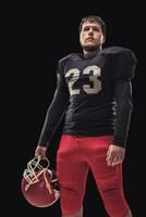 Football player on dark background photo