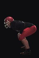 Football player on dark background photo