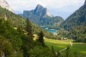 a mountain range with trees photo