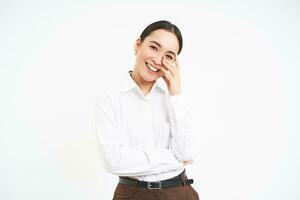 Wellbeing and workplace. Smiling happy asian saleswoman, office manager laughing and looking joyful, isolated over white background photo