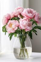 AI generated A close-up of a bouquet of pink peonies in a glass vase against a white background photo