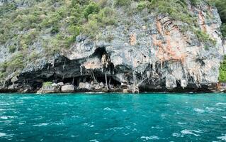 Mountain cliff limestone of swallow's nest concession island at Phi Phi photo