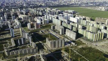 Aerial view of the new modern residential complexes in the large city with roads, parkings and playgrounds. Motion. Top view of modern building in Moscow region. photo