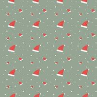 Seamless pattern of Santa hats on green background vector