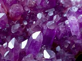 Amethyst red crystals. Gems. Mineral crystals in the natural environment. Texture of precious and semiprecious stones. photo
