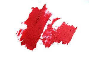 Red and pink lipstick swatch isolated on white background, cosmetic product, brush stroke, swipe sample. photo