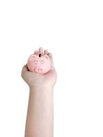 Male hand holding a piggy bank Isolated on a white background photo