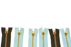 Black and blue zippers for clothes, repair on white photo