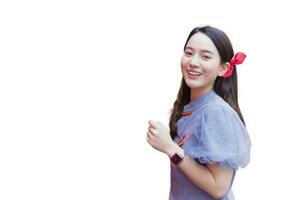 Young Asian beautiful woman in long hair wears  grey Chinese dress or called cheongsam dress with Chinese new year theme while isolated white background. photo