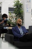 Company ceo analyzing data on laptop and planning business development while working in corporate office. Sales executive working on financial strategy in coworking space photo