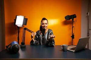 Vlogger recording video using professional microphone. Content creator new media star on social media recording for internet web online subscribers audience new podcast episode photo