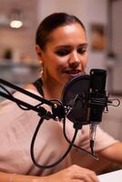 Close up of social media star talking in the microphone. Creative online show presenter, On-air online production internet broadcast show host streaming live content, recording digital social media photo