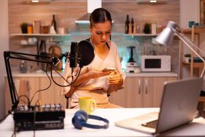 Social media star answering questions from online using phone in podcast. Creative online show On-air production internet broadcast host streaming live content, recording digital media photo