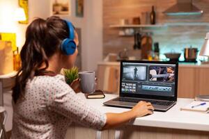 Professional colorist working in video footage during post production. Content creator in home working on montage of film using modern software for editing late at night. photo