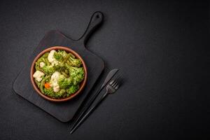 Delicious fresh vegetables steamed carrots, broccoli, cauliflower photo