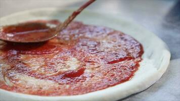 Spreading Tomato Paste On Pizza Dough video