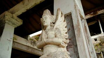 Mud covered Hindu statue stands in an abandoned building video