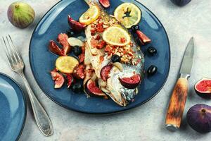 Tasty roasted dorado or gilt head bream fish photo