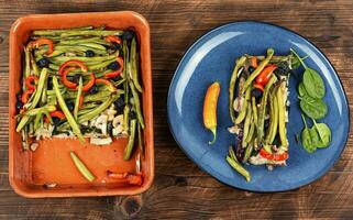 Green beans pie on a wooden table photo