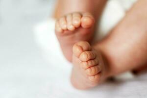 baby feet close up on white background photo