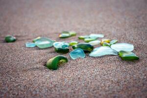 Mediterranean sea beach and glass stones photo. Glass stones from broken bottles polished by the sea photo