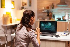 Access granted for woman hacker after cyber attack. Programmer writing a dangerous malware for cyber attacks using performance laptop during midnight. photo