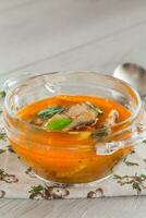 vegetable tomato soup with fish in a plate photo