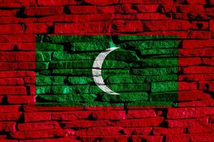 Flag of Republic of Maldives on a textured background. Concept collage. photo