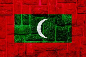 Flag of Republic of Maldives on a textured background. Concept collage. photo