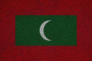 Flag of Republic of Maldives on a textured background. Concept collage. photo