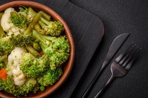 Delicious fresh vegetables steamed carrots, broccoli, cauliflower photo