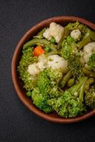 Delicious fresh vegetables steamed carrots, broccoli, cauliflower photo