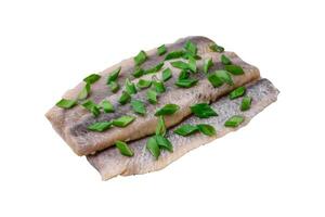 Delicious Atlantic herring marinated with salt and spices photo