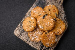 Delicious sweet round sponge cookies sprinkled with coconut flakes photo