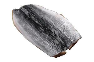 Delicious salted herring fillet in oil on a black ceramic plate photo