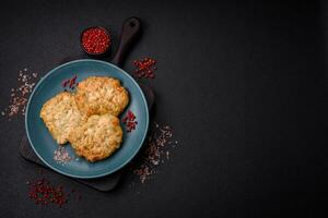 Delicious fresh fried minced fish cutlets with spices and herbs photo