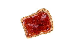 Nutritious sandwiches consisting of bread, raspberry jam and peanut butter photo