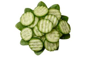 Delicious healthy raw cucumber sliced on a black ceramic plate photo