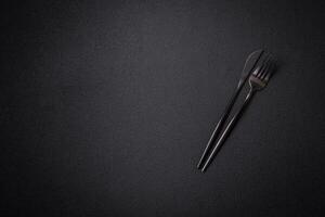 Kitchen knife and fork made of steel with copy space photo